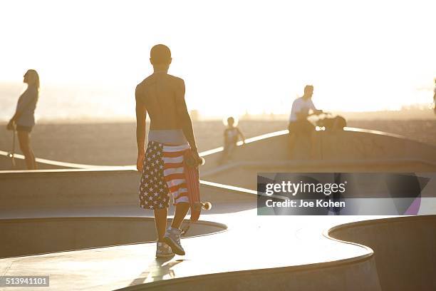 Man skateboarding in Venice beach CA on September 15, 2014.