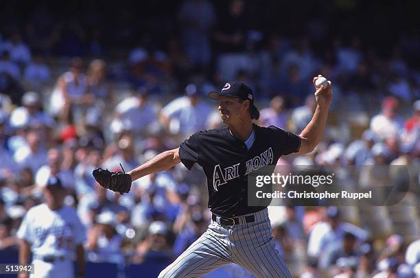 Pitcher Randy Johnson of the Arizona Diamondbacks throwing the ball during the game against the Los Angeles Dodgers at Dodger Stadium in Los Angeles,...