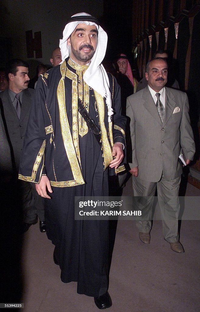 Uday Reebye Saddam Hussein's eldest son Uday walks into a Parliament meeting in ...