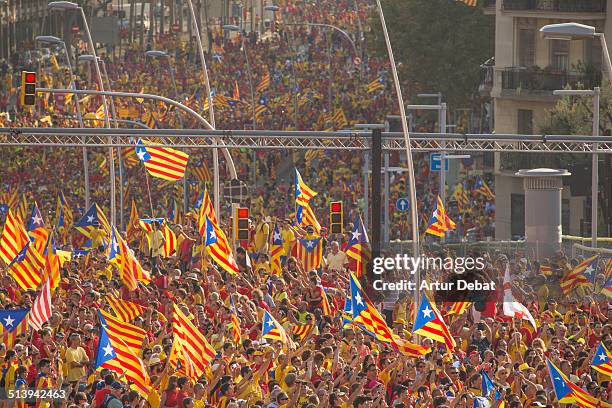 Catalan people celebrates the Catalonia national day on 9/11 with a rally in the streets of Barcelona with the streets of Gran Via and the Diagonal...