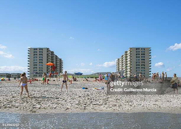 People playing and enjoying at the Rockaway Beach in Queens New York. August 24, 2014