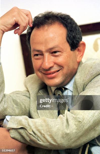 Egyptian Naguib Sawiris, chairman of Egypt's Orascom Telecom, smiles as he answers reporters questions in Cairo. Egypt's Orascom Telecom is emerging...