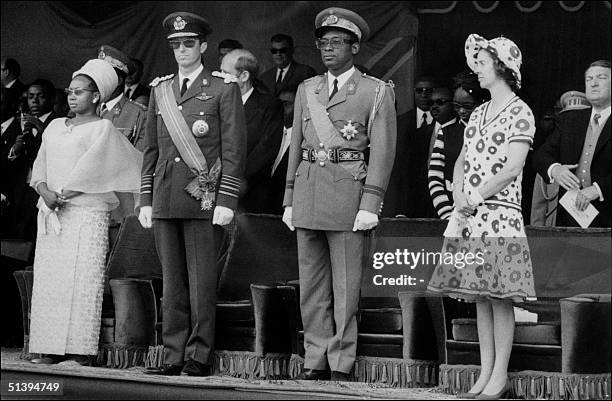 President of Zaire General Joseph-DTsirT Mobutu Sese Seko , KIng Baudouin of Belgium, Queen Fabiola and Mobutu's wife, review troops 30 June 1970 in...