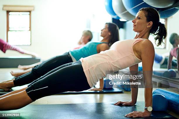 her favorite way to stay lean and limber - stay indoors stock pictures, royalty-free photos & images