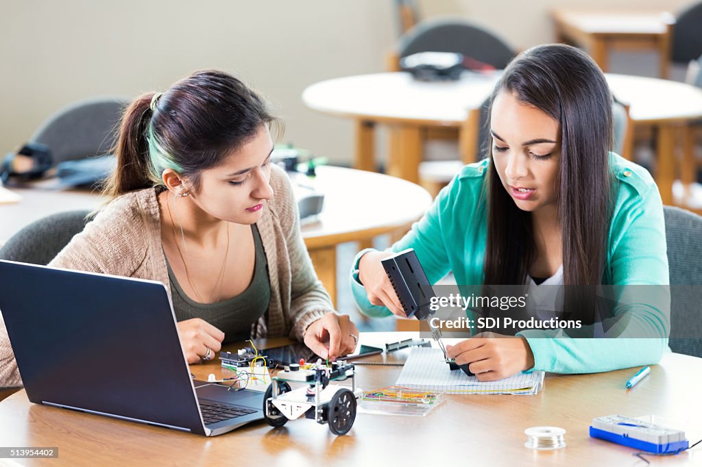 High school friends working on robotics assignment