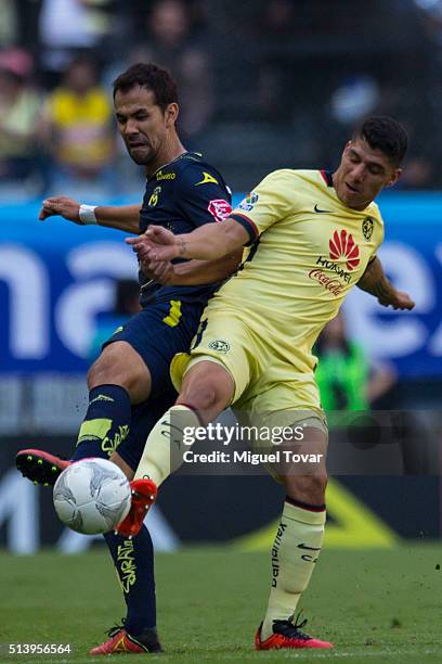 Jose Guerrero of America fights for the ball with Pablo Vazquez of Morelia during the 9th round match between America and Morelia as part of the...