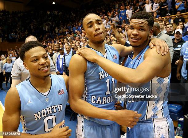 Teammates Brice Johnson Nate Britt and Kennedy Meeks of the North Carolina Tar Heels celebrate after defeating the Duke Blue Devils 76-72 at Cameron...