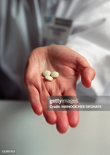 Nurse shows a box of the RU486 pill at the family planning department of Hopital Broussais, 25 October 2000.