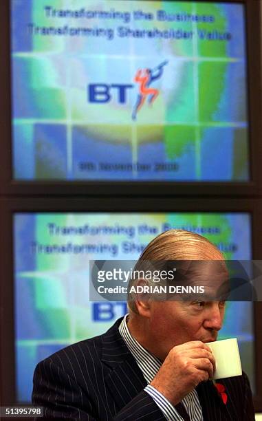 Sir Iain Vallance, Chairman of British Telecom, sips a cup of tea before a press conference at BT Headquaters in London 09 November 2000. The company...