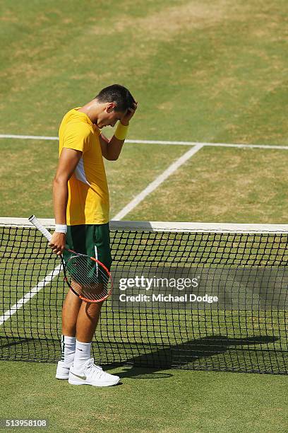 Bernard Tomic of Australia loses the third set in his match against John Isner of the USA during the Davis Cup tie between Australia and the United...