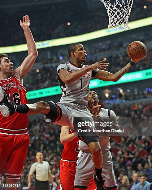 Trevor Ariza of the Houston Rockets goes up for a shot past Pau Gasol of the Chicago Bulls at the United Center on March 5, 2016 in Chicago,...