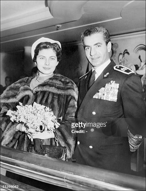 Mohammad Reza Pahlavi, the Shah of Iran, and his wife Empress Soraya pose for the media in March 1953 in Tehran.