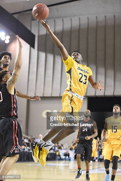 Mike Morsell of the Towson Tigers drives to the basket during the quarterfinals of the Colonial Athletic Conference Tournament college basketball...