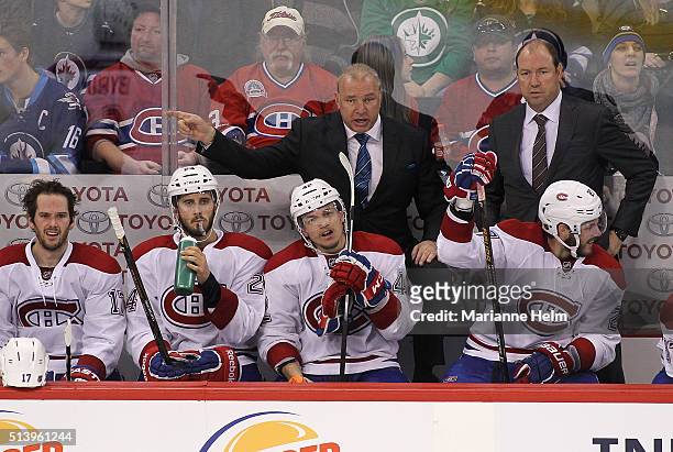 Michel Therrien, head coach of the Montreal Canadiens, gestures from the bench in third period action in an NHL game against the Winnipeg Jets at the...
