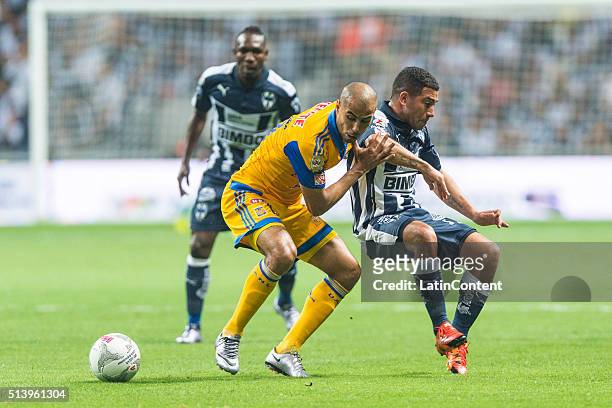 Guido Pizarro of Tigres fights for the bal with Walter Gargano of Monterrey during the 9th round match between Monterrey and Tigres UANL as part of...