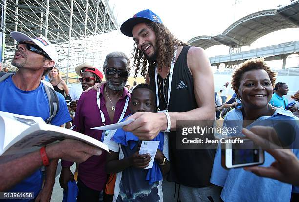 Joakim Noah, son of Yannick Noah and NBA player for Chicago Bulls, and Yannick's father, Zacharie Noah attend day 2 of the Davis Cup World Group...