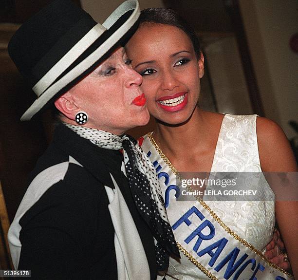 Miss France pageant organizer Genevieve de Fontenay embraces Miss France 2000 Sonia Rolland in Nicosia 13 May. Miss France was one of the ten...