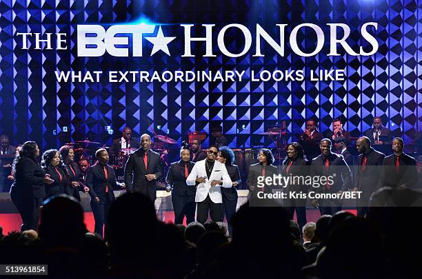Recording artist Raheem DeVaughn and the Destiny Rode Choir perform on stage during the BET Honors 2016 Show at Warner Theatre on March 5, 2016 in...