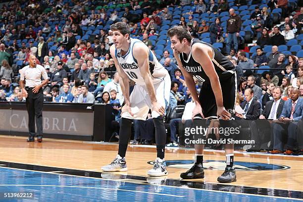 Damjan Rudez of the Minnesota Timberwolves and Sergey Karasev of the Brooklyn Nets looks on during the game on March 5, 2016 at Target Center in...