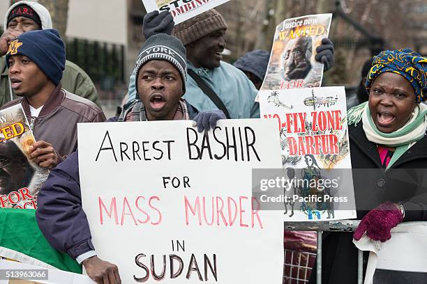 Activists hold signs and chant, demanding the arrest of Omar al-Bashir. On the seventh anniversary of the first issuance by the International...