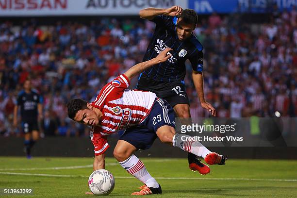 Michael Perez of Chivas struggles for the ball with Jonathan Bornstein of Queretaro during the 9th round match between Queretaro and Chivas as part...