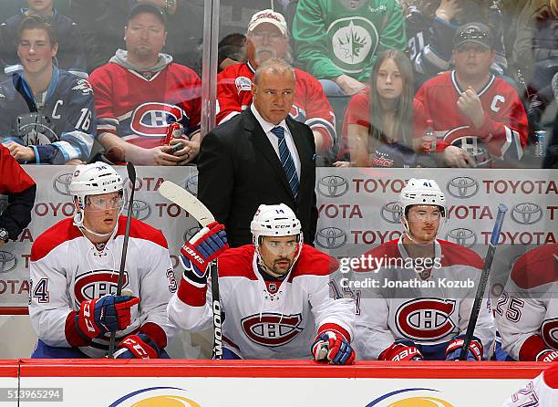 Head Coach Michel Therrien of the Montreal Canadiens looks on from the bench during third period action against the Winnipeg Jets at the MTS Centre...