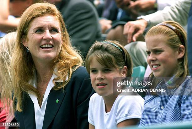 The Duchess of York Sarah Ferguson with children Eugenie and Beatrice during a charity tennis match in the gardens of Buckingham Palace in London 02...