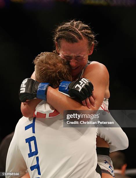 Miesha Tate reacts to her victory over Holly Holm in their UFC women's bantamweight championship bout during the UFC 196 event inside MGM Grand...