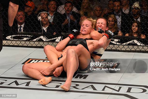 Miesha Tate attempts to submit Holly Holm in their UFC women's bantamweight championship bout during the UFC 196 event inside MGM Grand Garden Arena...