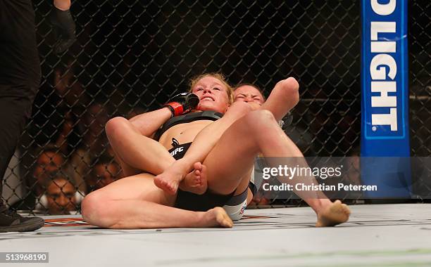 Miesha Tate attempts to submit Holly Holm in their UFC women's bantamweight championship bout during the UFC 196 event inside MGM Grand Garden Arena...