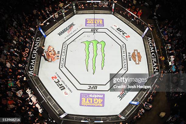 An overhead view of the Octagon as Miesha Tate attempts to submit Holly Holm in their UFC women's bantamweight championship bout during the UFC 196...