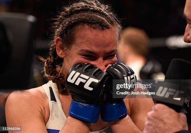 Miesha Tate reacts to her victory over Holly Holm in their UFC women's bantamweight championship bout during the UFC 196 event inside MGM Grand...