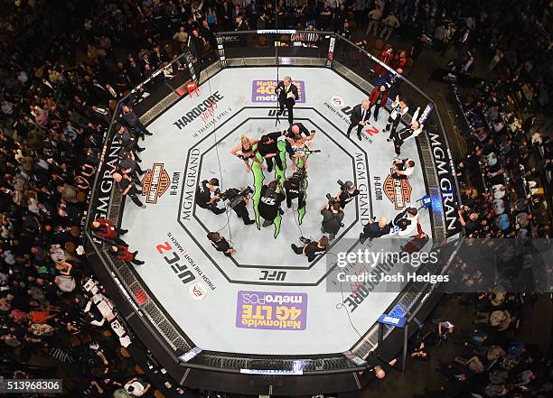 An overhead view of the Octagon as Miesha Tate reacts to her victory over Holly Holm in their UFC women's bantamweight championship bout during the...
