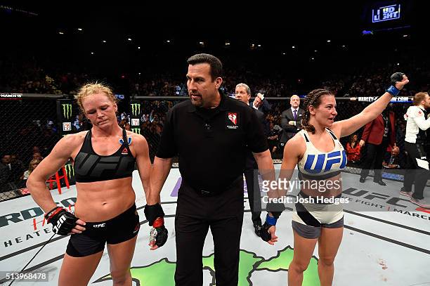 Holly Holm and Miesha Tate await the final decision in their UFC women's bantamweight championship bout during the UFC 196 event inside MGM Grand...