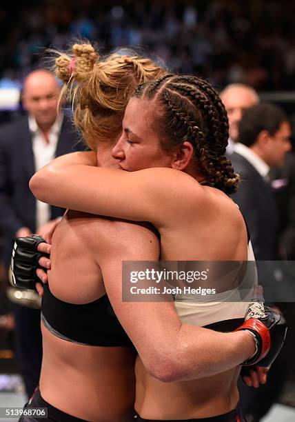 Holly Holm and Miesha Tate embrace after their UFC women's bantamweight championship bout during the UFC 196 event inside MGM Grand Garden Arena on...