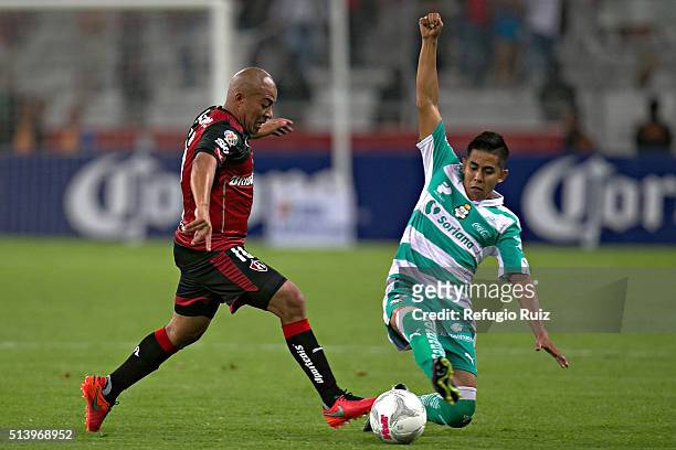 Egidio Arevalo of Atlas fights for the ball with Nestor Calderon of Santos during the 9th round match between Atlas and Santos Laguna as part of the...