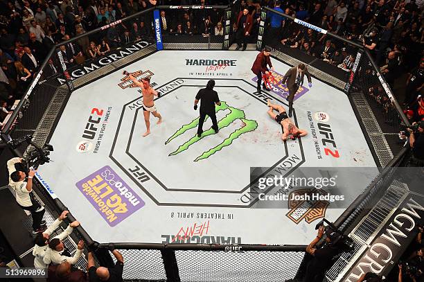 An overhead view of the Octagon as Nate Diaz reacts to his victory over Conor McGregor of Ireland in their welterweight bout during the UFC 196 event...