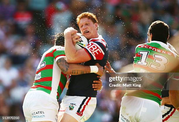 Dylan Napa of the Roosters is tackled during the round one NRL match between the Sydney Roosters and the South Sydney Rabbitohs at Allianz Stadium on...