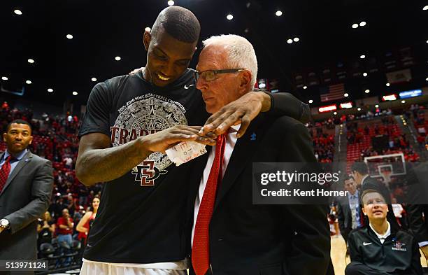 Winston Shepard and head coach Steve Fisher of the San Diego State Aztecs share a moment during post game celebrations after the game against the...