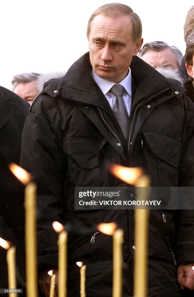 Acting Russian President Vladimir Putin pays his r