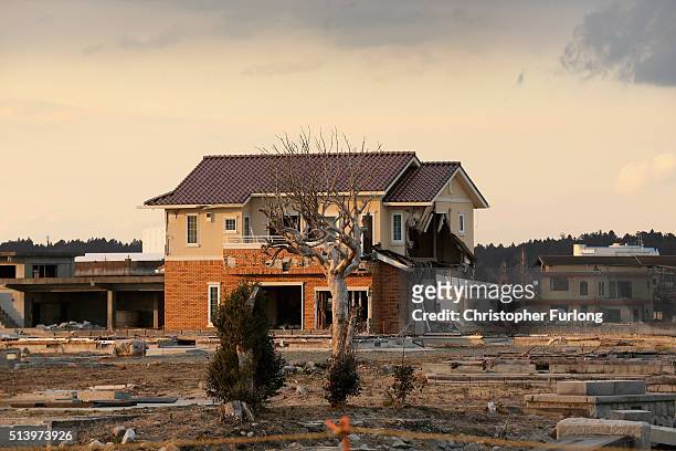 Lone house sits on the scarred landscape, inside the exclusion zone, close to the devastated Fukushima Daiichi Nuclear Power Plant on February 26,...
