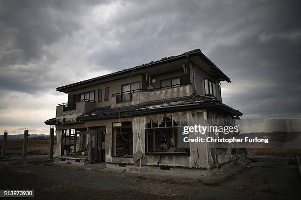 Lone house sits on the scarred landscape, inside the exclusion zone, close to the devastated Fukushima Daiichi Nuclear Power Plant on February 26,...