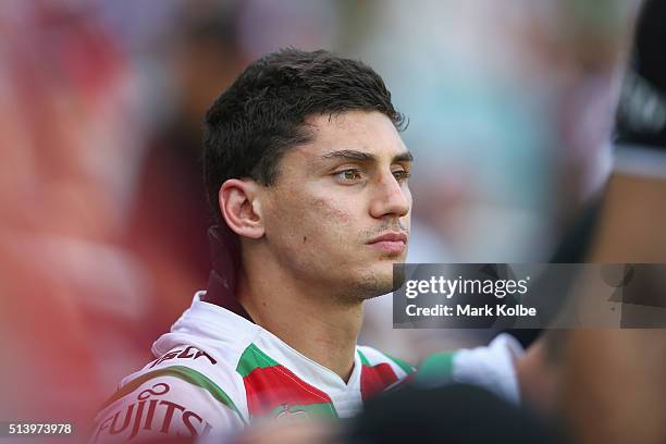 Kyle Turner of the Rabbitohs watches on from the bench after leaving the field with an injury during the round one NRL match between the Sydney...