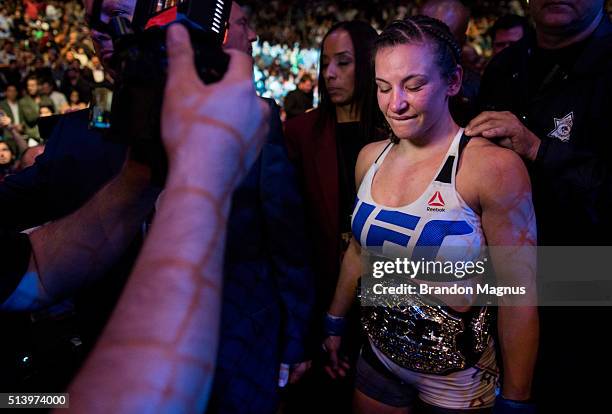 Miesha Tate celebrates her submission victory over Holly Holm after their women's bantamweight championship bout during the UFC 196 in the MGM Grand...