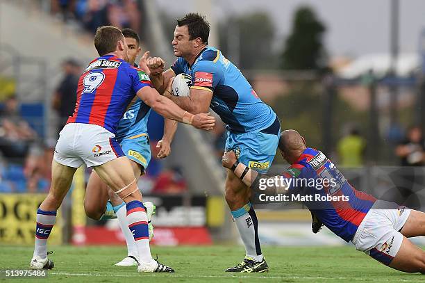 David Shillington of the Titans is tackled during the round one NRL match between the Gold Coast Titans and the Newcastle Knights at Cbus Super...