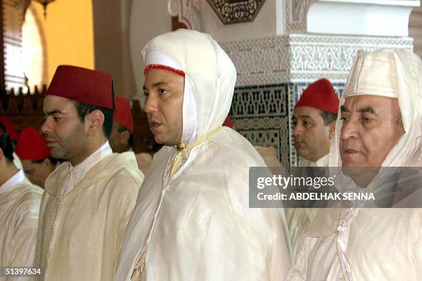 King Mohammed VI of Morocco , his brother Moulay Rachid and Moroccan Prime Minister Abderrahmane Youssoufi attend the prayer during the Eid al-Adha...