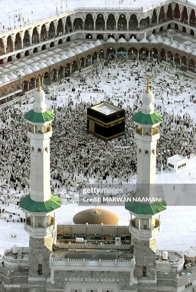 Muslim pilgrims rotate around the holy Kaaba in th