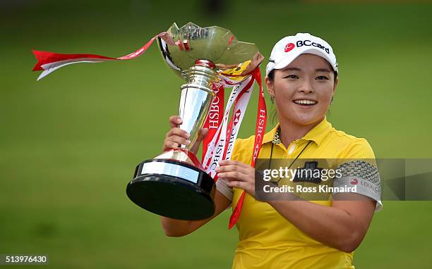 Ha Na Jang of South Korea celebrates with the winners trophy after the final round of HSBC Women's Champions at the Sentosa Golf Club on March 6,...