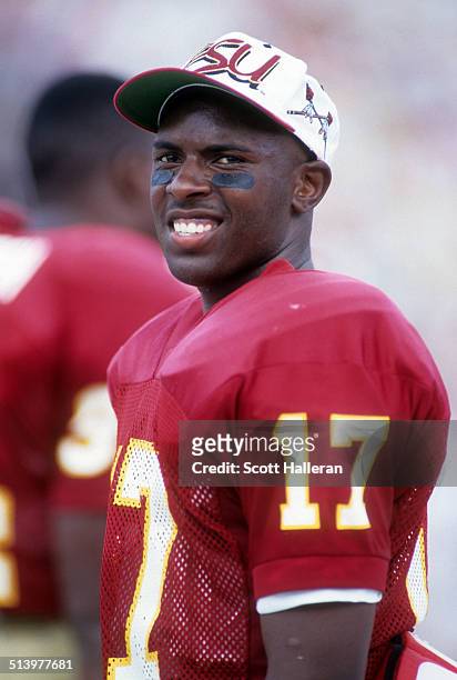 Quarterback Charlie Ward of the Florida State Seminoles looks on from the bench during an NCAA game against the Clemson Tigers on September 11, 1993...