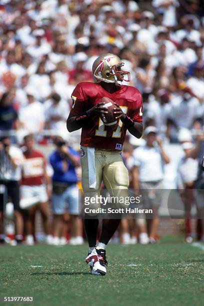 Quarterback Charlie Ward of the Florida State Seminoles readies to throw the ball during an NCAA game against the Clemson Tigers on September 11,...